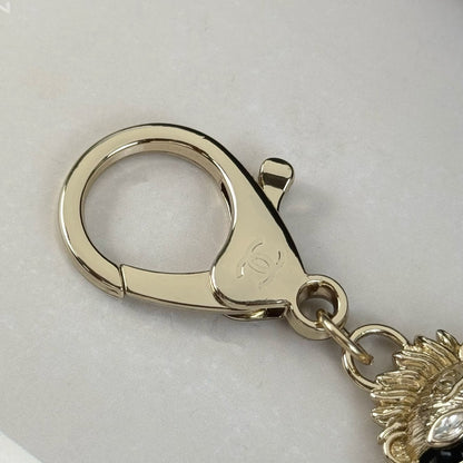 Luxury-Inspired Lion Figure Bag Charm, Gold-Tone Enamel Keychain with Crystal Accents