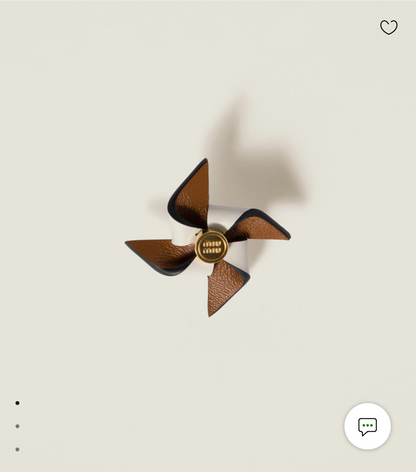 Leather pinwheel brooch
